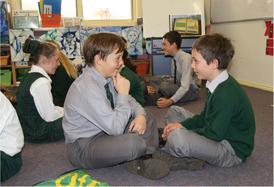 Students take to the floor to discuss in pairs