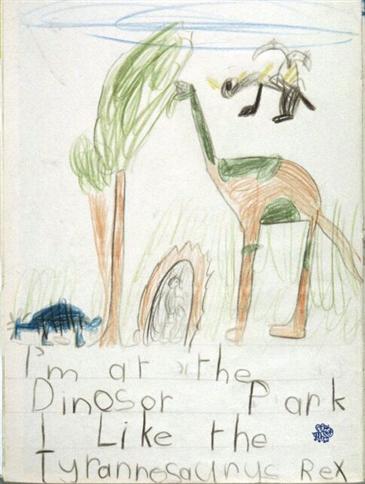 Child's drawing with the text ‘I’m at the Dinosor (sic) Park/ I like Tyrannosaurys (sic) Rex’